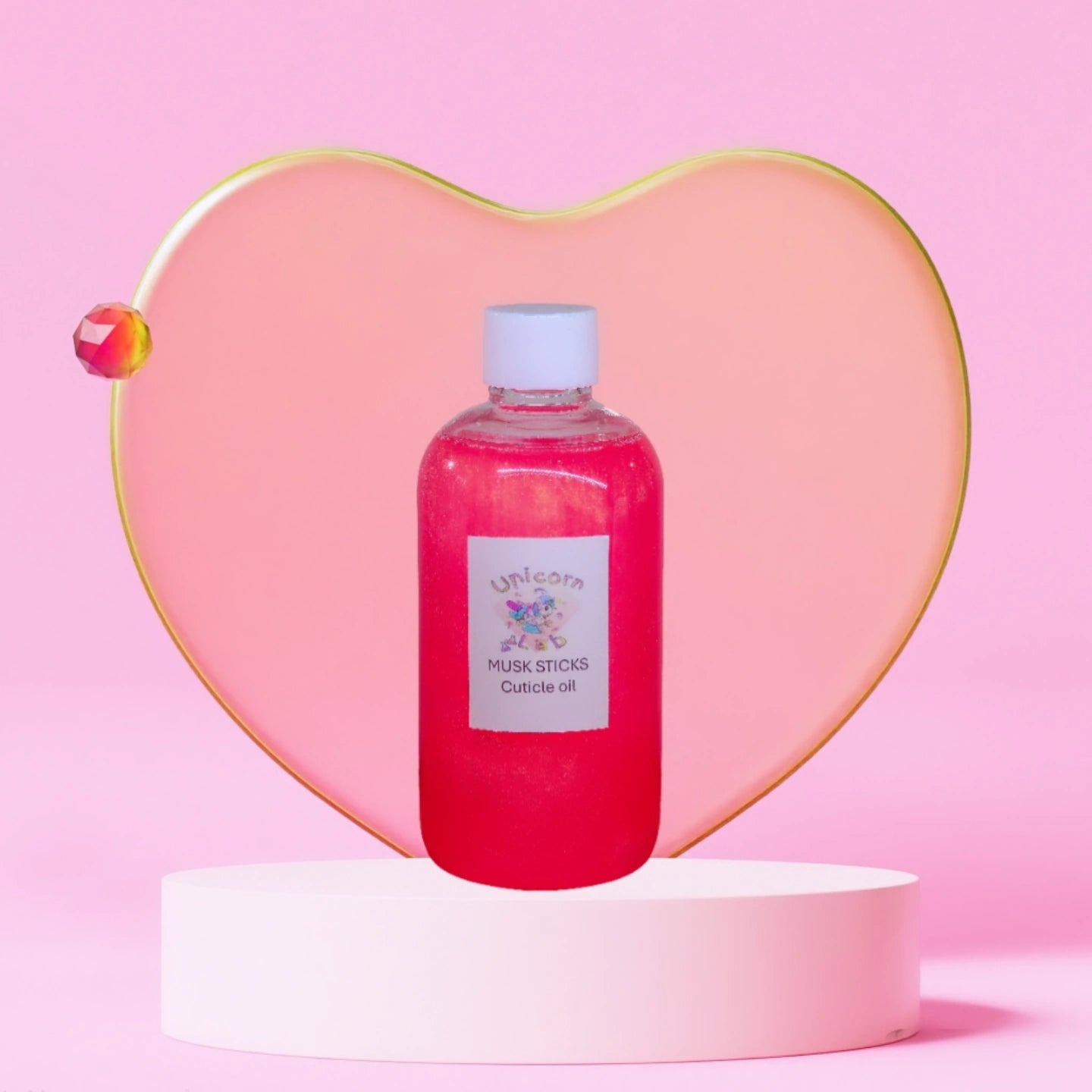 Refill bottle of cuticle oil on a pedestal 