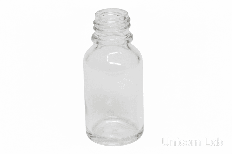 Clear glass  15ml round bottle on a white background