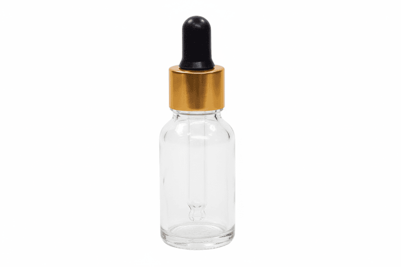 Clear glass  15ml round dropper bottle with a black cap on a white background