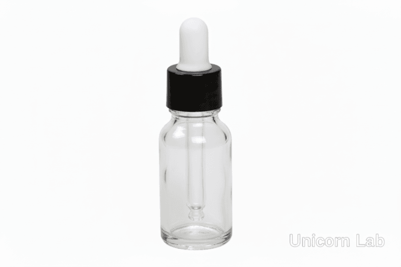 clear round glass dropper bottle with black cap and white rubber