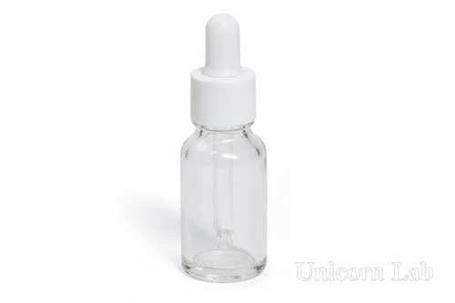 Clear 15ml round glass dropper bottle with white cap on a white background