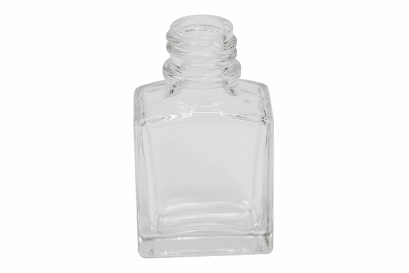 Clear square nail polish bottle on a pink background