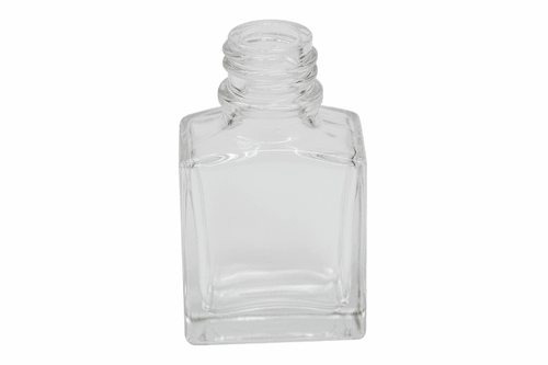 Clear square nail polish bottle on a pink background