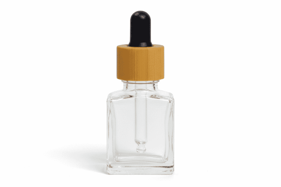 Clear glass 15ml square dropper bottle with wooden cap on a white background