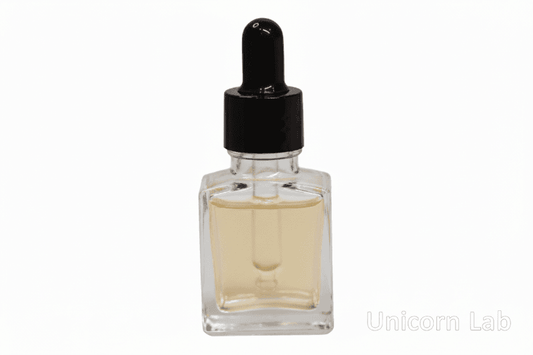 Clear glass 15ml square dropper bottle with black cap on a white background