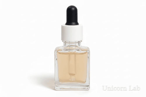 Clear glass 15ml square dropper bottle with black and white cap on a white background
