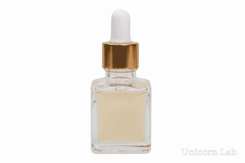 Clear 15ml square glass dropper bottle with gold cap on a white background
