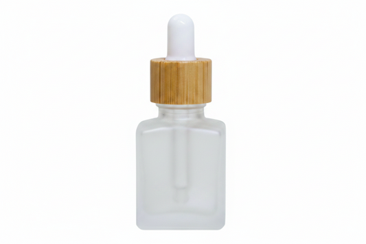 Frosted 15ml square glass dropper bottle with wooden cap on a white background