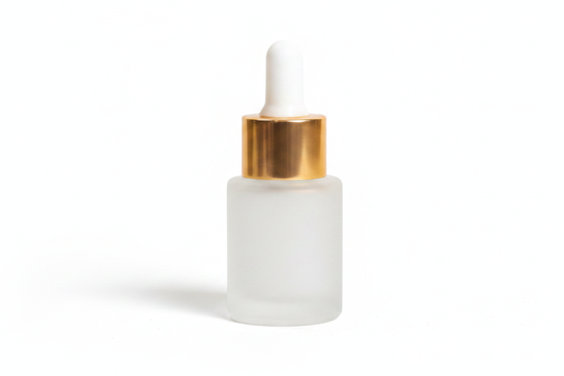 Frosted 15ml flat shoulder dropper bottle with gold cap on a white background