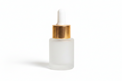 Frosted 15ml flat shoulder dropper bottle with gold cap on a white background