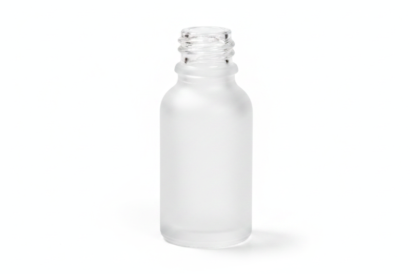 Frosted glass empty bottle on a white background