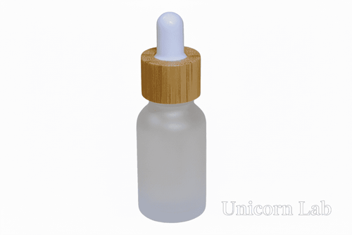 Frosted glass 15ml round dropper bottle with a wooden cap on a white background
