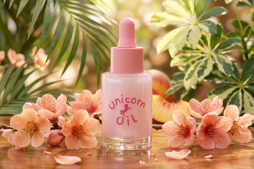 30ml glass dropper bottle of Tropical Peach Blossom scented Cuticle Oil. Australian made cuticle care products featuring a shimmering golden-peach liquid.