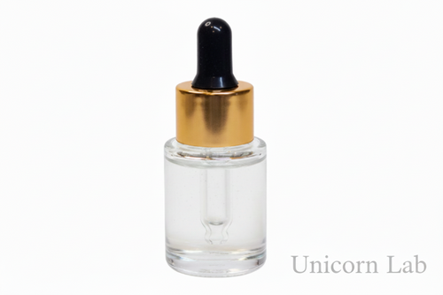 Clear glass dropper bottle with gold cap