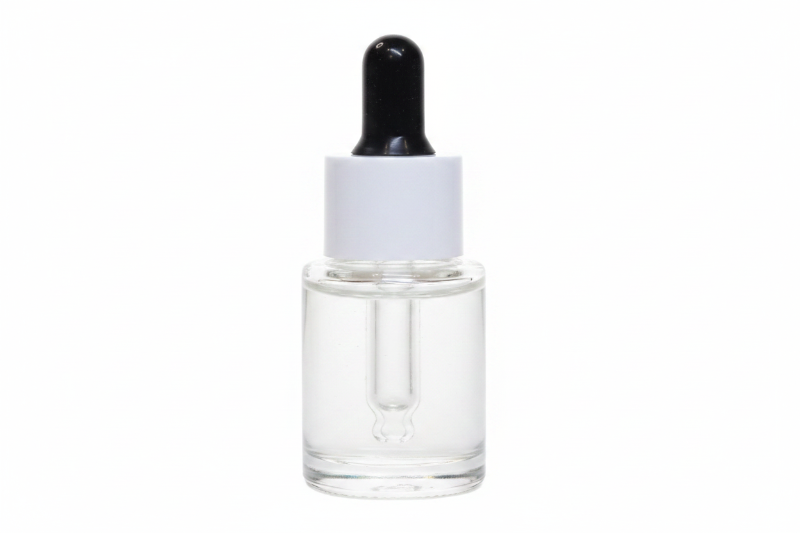 Skincare dropper bottle with beige liquid on a white background