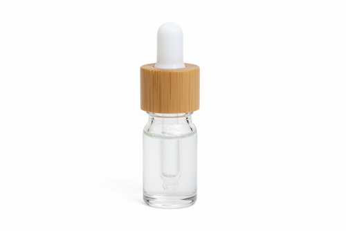 Glass clear 5ml round dropper bottle with a wooden cap on a white background