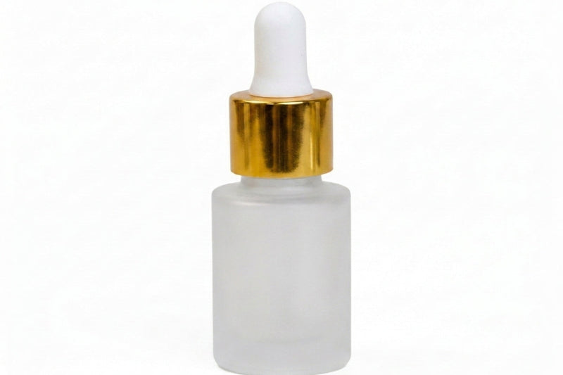 A frosted glass dropper bottle with a white rubber bulb and a shiny gold collar, shown on a plain white background.