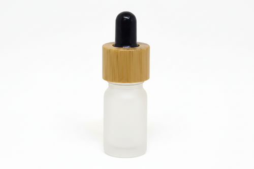 White glass frosted 5ml round dropper bottle with a bamboo cap on a white background