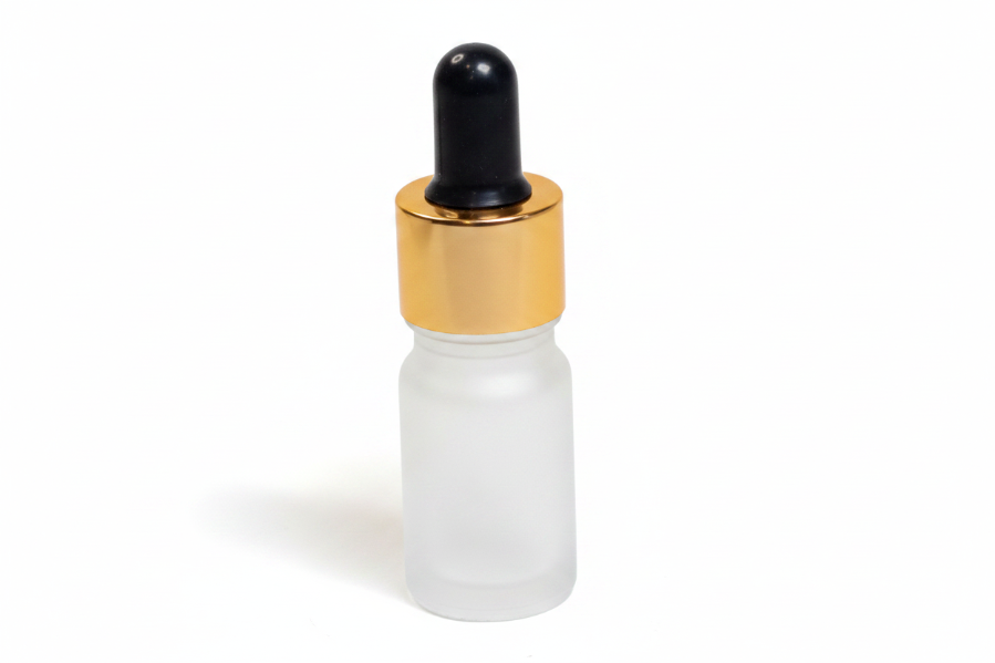 White glass frosted 5ml round dropper bottle with a gold cap on a white background