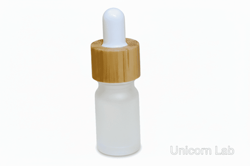 Glass 5ml frost round dropper bottle with wooden cap on a white background