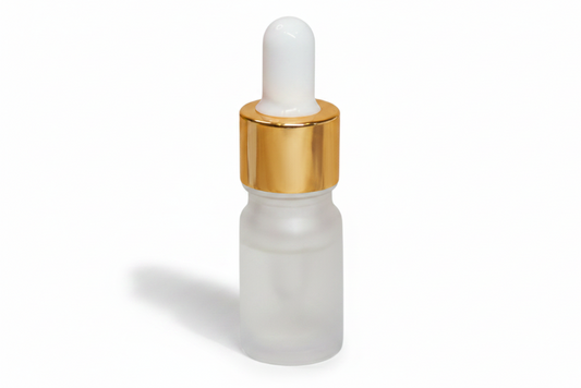 Frosted glass 5ml round dropper bottle with gold cap on a white background