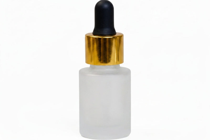 A frosted glass dropper bottle with a shiny gold collar and a black rubber bulb, shown on a plain white background.