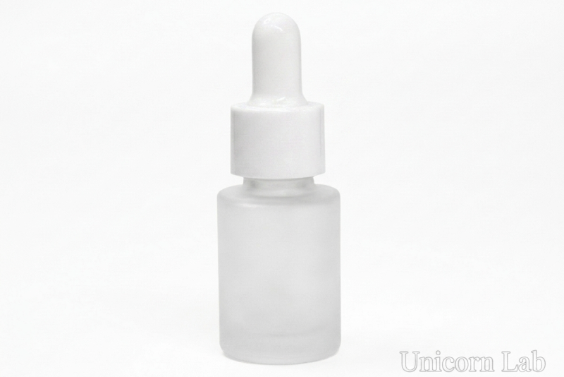 A frosted glass dropper bottle with a white cap and bulb, shown on a plain white background with a faint 'Unicorn Lab' watermark in the bottom right corner.