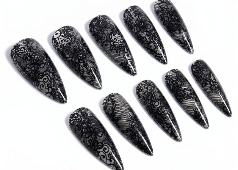 Set of black lace nail art designs on a white background