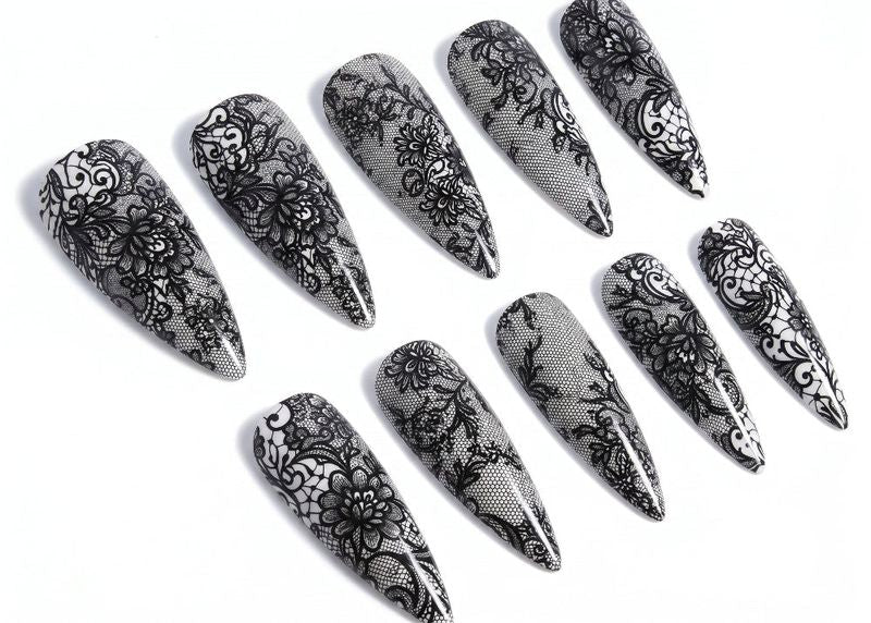 Set of black lace nail art designs on clear nails