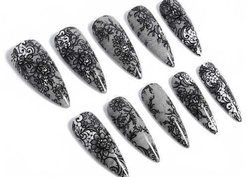 Set of black lace nail art designs on clear nails