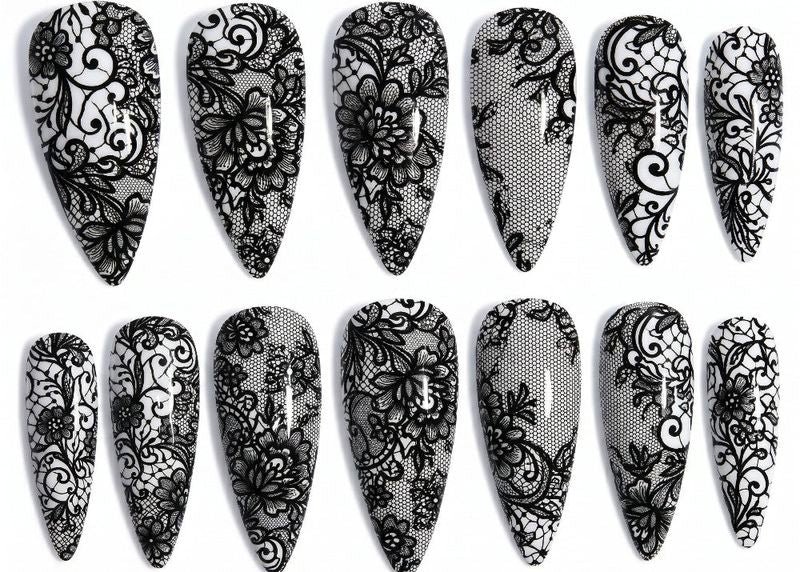 Set of black lace nail designs on a white background