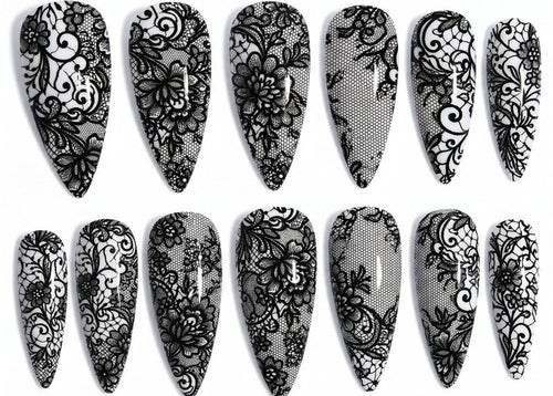 Set of black lace nail designs on a white background