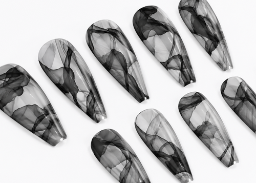 Set of black and gray marbled nail art designs on a white background