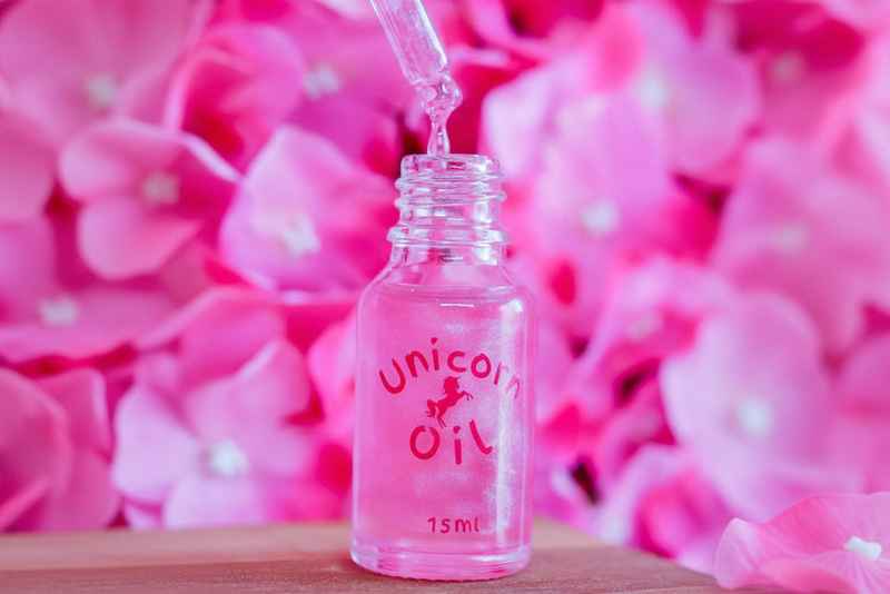 Cherry blossom cuticle oil dropper with clean floral styling, hydrating nail serum