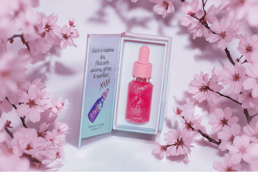 Cherry blossom cuticle oil dropper with clean floral styling, hydrating nail serum