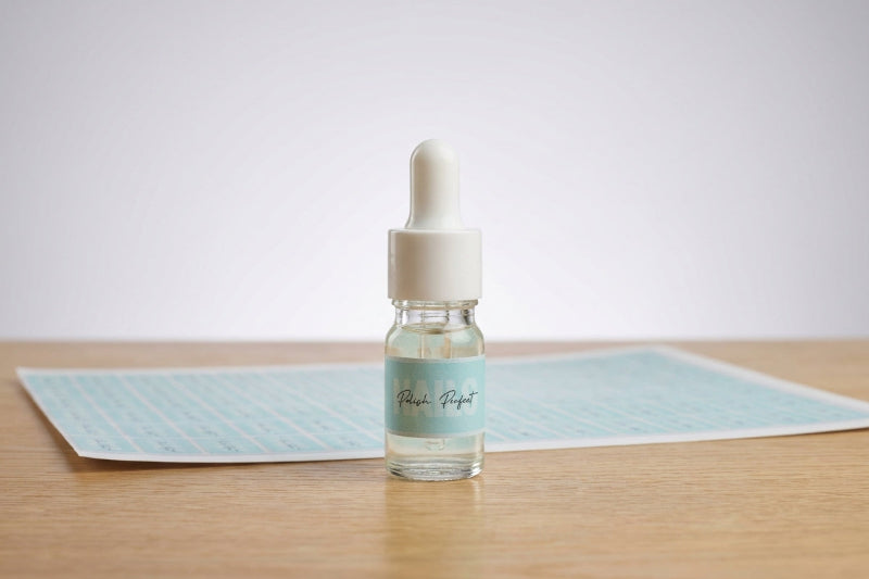 Small dropper bottle with a label on a wooden surface