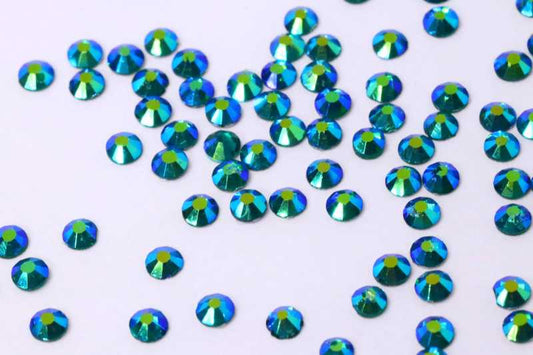Bulk factory pack of Blue Zircon AB SS6 (2.0mm) teal-blue iridescent glass flatback rhinestones for professional nail art.