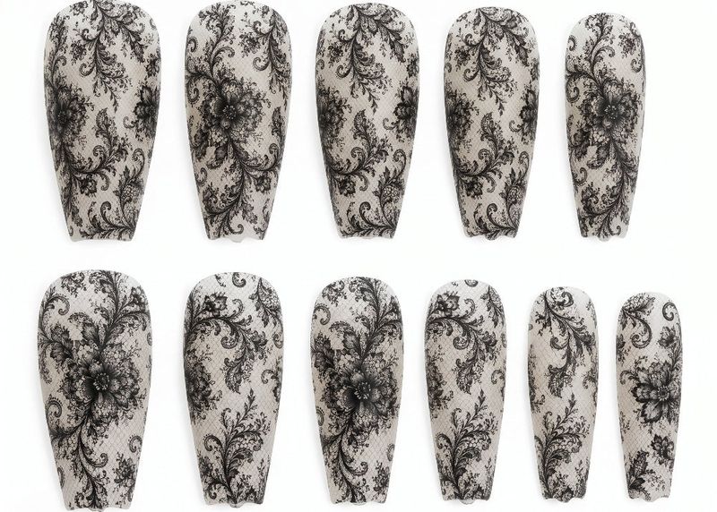 Set of nail wraps with black floral pattern on a white background