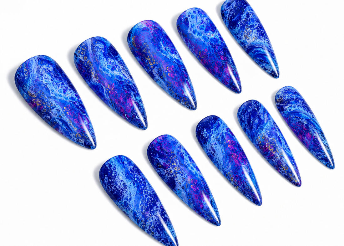 Blue marbled nail art designs on a white background