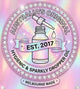 Promotional graphic for 'Australia's Original Hygienic & Sparkly Dropper Oil' establish in 2017 with a bottle and dropper on a colorful, glittery background. Made in Melbourne 