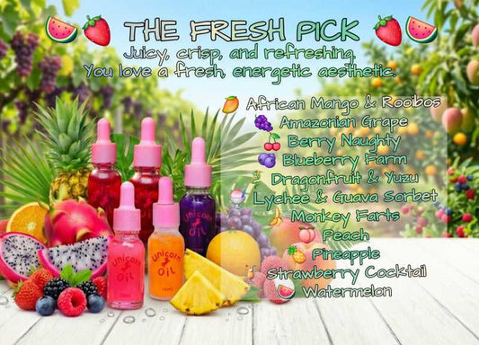 Assorted colorful bottles of cuticle oil with fruit and plant elements on a wooden surface.