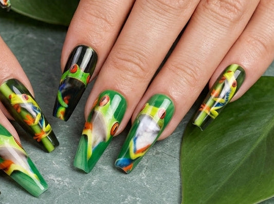 Nails with frog and bamboo design on a green leaf background