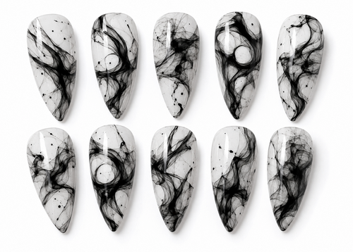 Set of black and white marbled nail art designs on a white background