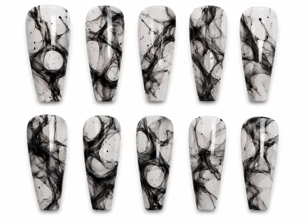 Set of black and white marbled nail art designs on a white background
