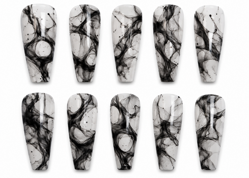 Set of black and white marbled nail art designs on a white background