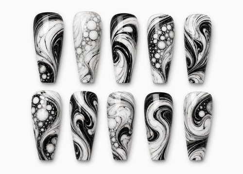 Black and white marbled nail art designs on a white background