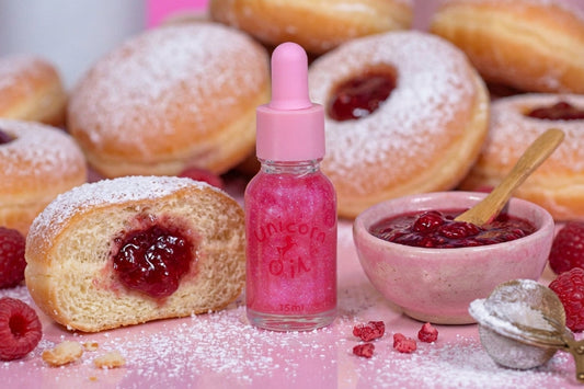 Jam donut scented cuticle oil, surrounded by raspberry jam donuts, Australian made cuticle oils.