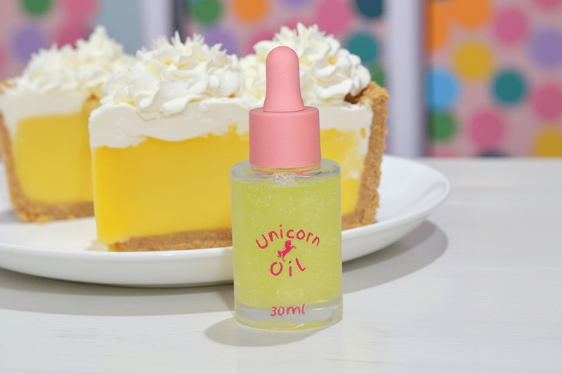 15ml glass dropper bottle of Lemon Meringue nail serum with a golden citrus-scented oil and swirling shimmer.