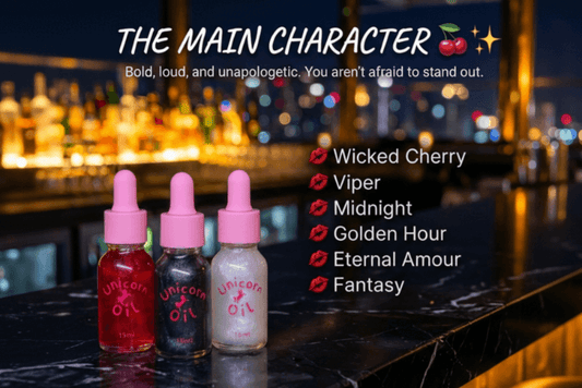 Three bottles of Unicorn Oil with pink caps on a bar counter, featuring text about product names and a cityscape in the background.