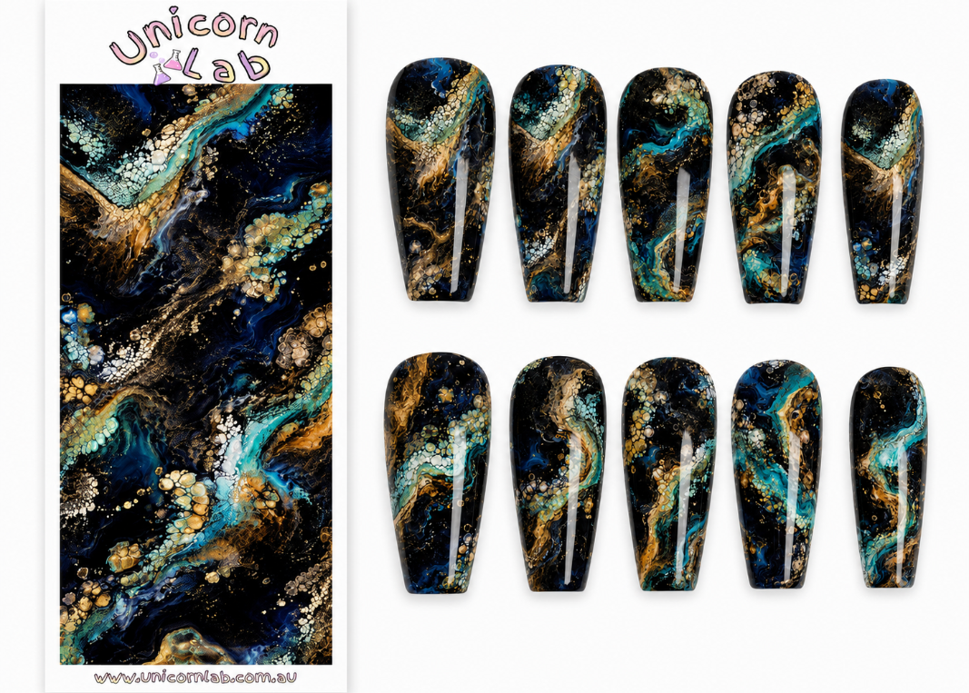 Nail art wraps with a cosmic design on a white background, branded 'Unicorn Lab'.
